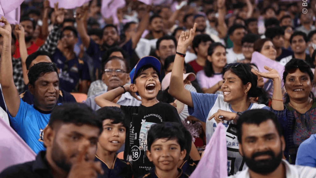 IPL 2026 GT vs SRH fans cheering with lavender flags at Narendra Modi Stadium